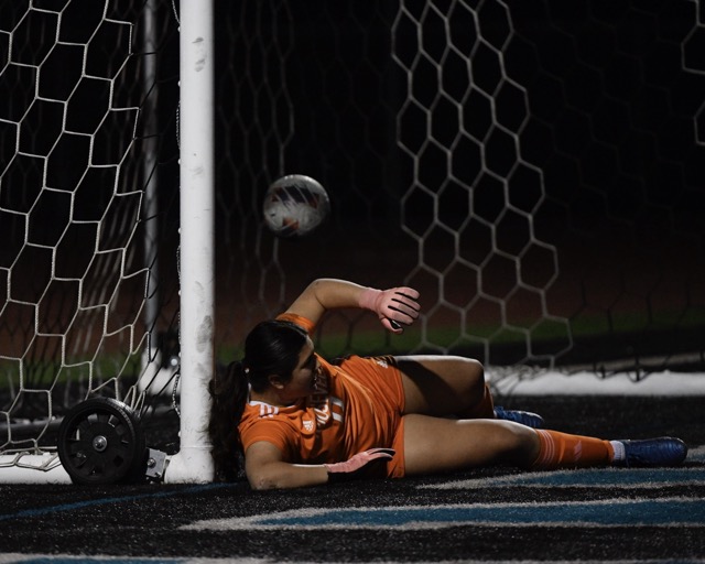 Roosevelt goalie Giulianna Vargas can't stop a shot by Santiago's Abbie Kelly that gave the Sharks a 2-all tie in a Big VIII League game at Santiago 
Credit: Photo by Jerry Soifer
