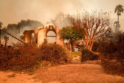 California Homeowners. The remains of a smoldering home in an Altadena neighborhood affected by the Eaton Fire on Jan. 8, 2025. California's insurer of last resort is facing $1 billion in losses from Southern California wildfires.  Credit: Photo by Jules Hotz for CalMatters