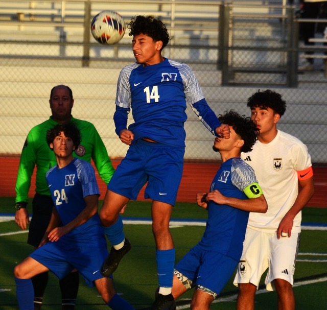 Norco’s Andre Berrera (14) leaps high for the header while teammates Nahum Palacious (24) and Abraham Garcia (C armband) and a Calabasas player watch. The Cougars and Coyotes, in an instant classic game, battled through a scoreless tie and two 10-minute scoreless overtime periods. The game was settled in the shootout when Calabasas nipped the Cougars by one goal to advance in the CIF playoffs. Credit: Photo by Gary Evans Norco’s Andre Berrera (14) leaps high for the header while teammates Nahum Palacious (24) and Abraham Garcia (C armband) and a Calabasas player watch. The Cougars and Coyotes, in an instant classic game, battled through a scoreless tie and two 10-minute scoreless overtime periods. The game was settled in the shootout when Calabasas nipped the Cougars by one goal to advance in the CIF playoffs. Norco’s Andre Berrera (14) leaps high for the header while teammates Nahum Palacious (24) and Abraham Garcia (C armband) and a Calabasas player watch. The Cougars and Coyotes, in an instant classic game, battled through a scoreless tie and two 10-minute scoreless overtime periods. The game was settled in the shootout when Calabasas nipped the Cougars by one goal to advance in the CIF playoffs. Credit: Photo by Gary Evans