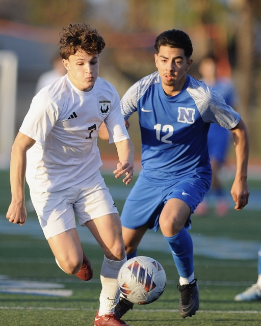 Featured Photos 02-21-2025. Norco's Jeovani Mercado, right, battles for the soccer ball against Calabasas' Hadar Moskowitz early in the CIF Div. 2 second-round playoff game at Norco Saturday. Calabasas won on penalty kicks after a scoreless tie. Photo by Jerry Soifer