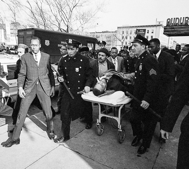 February 21. Malcolm X, on stretcher, is taken from the Audubon Ballroom after being shot Credit: United Press International