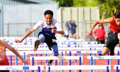 Featured Photos 3-21-25. Corona’s Kobi Jasso (left) prevails over Norco’s Kadyn Camacho (center) and Panther teammate Josh Gutierrez (right) in 110 High Hurdles. Credit: Photo by Gary Evans