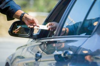 Blue Envelope. A California Highway Patrol officer stops a motorist along Interstate 405 in Westminster on April 23, 2020.  Credit: Photo by Chris Carlson, AP Photo