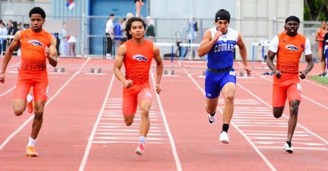 (L-R) Roosevelt’s Chuck Uzoma, Levi Yancy, Norco’s Dillon Dawud, and Roosevelt’s Isaiah Charles compete  in the boys 200 varsity dash.  Dawud prevailed, setting a personal record.
Credit: Photo by Gary Evans

