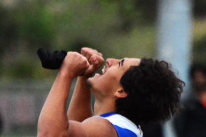 Norco’s Dillon Dawud celebrates his personal record run of 23.37 in the boys’ 200 dash against Roosevelt. Photo by Gary Evans