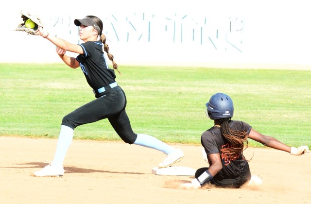 Norco’s Leighton Gray catches the throw from pitcher Camryn May for the force at second of Roosevelt’s Taniyah Washington (55) during the Cougars 3 – 0 victory over the Mustangs.
Credit: Photo by Gary Evans
