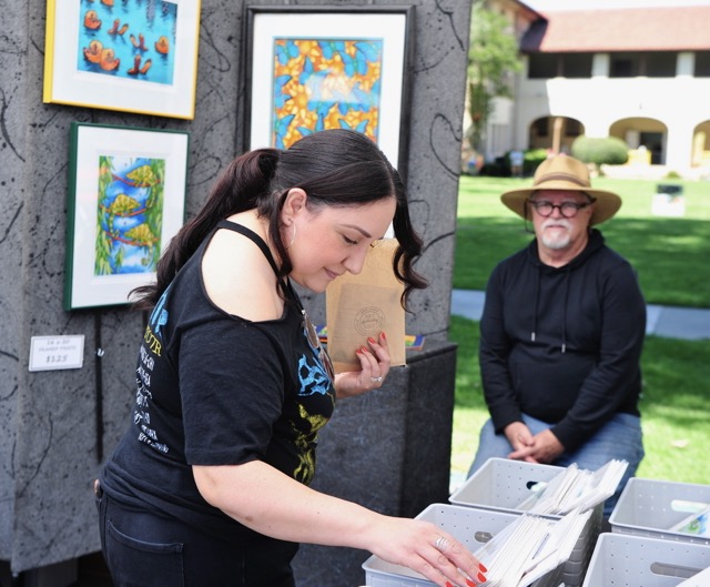 Diane Bravo, of Corona, peruses the work of artist Pat Cranor, of La Verne, at the Corona Arts and Music Festival at the Historic Civic Center Saturday.
Credit: Photo by Jerry Soifer

