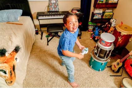 Nathan Gandolfi, 10, in his bedroom in Highland on April 16, 2025. Credit: Photo by Kyle Grillot for CalMatters