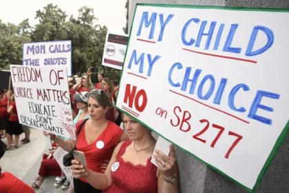 Vaccine Requirements. Karman Willmer, left, and Shelby Messenger protest against SB 277, a measure requiring California schoolchildren to get vaccinated, at a Capitol rally on June 9 in Sacramento. (Rich Pedroncelli / Associated Press)