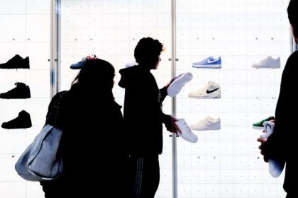 Buy Now, Pay Later. Caption: People shop for shoes in a Nike store on Nov. 25, 2022, in New York. Credit: Julia Nikhinson, AP