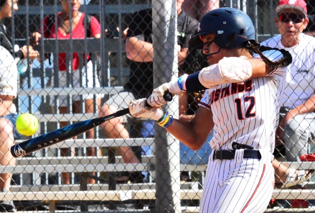 Eastvale Roosevelt’s Loto Sivas (12) hammers a line drive home run just over the left field fence scoring the only run in the win over Fullerton.