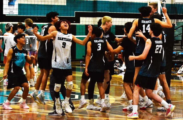 Santiago’s Elijah Tajo (9) exalts after the Sharks rebounded after losing the first two sets to sweep the next three to defeat the Westlake Warriors in the CIF quarter-final playoffs.  Santiago was swept in the semi-finals by Santa Barbara.  Celebrating in the background include Caleb Guieb (3), Spencer Tran (14) and Brady Allen (27). 
Credit: Photo by Gary Evans
