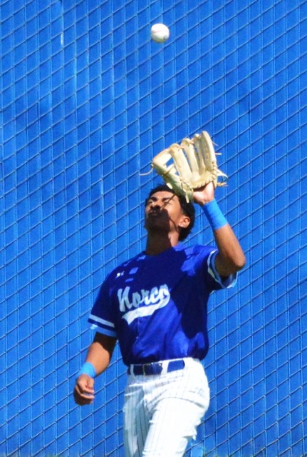 Featured Photos 05-30-2025. Norco left fielder Marcus Blanton catches a pop fly during the second inning of the Division 1 CIF playoff game against Corona.