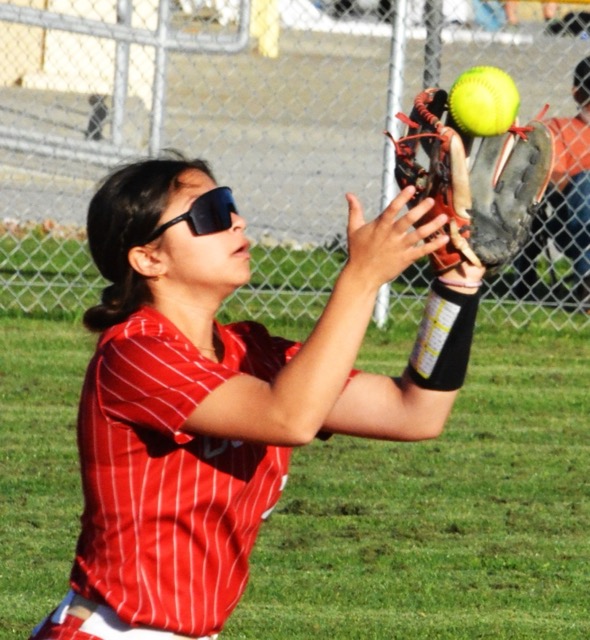 Corona shortstop Nicole Ramirez catches a line drive against Norco.  The Cougars defeated the Panthers 16 - 1.