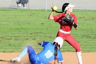 Featured Photos 5-2-2025. Corona second baseman Alexis Morales catches the throw from shortstop Marely Medina for the force of Norco’s Kendra Nelsen (18) at second base, but they were unable to turn the double play.