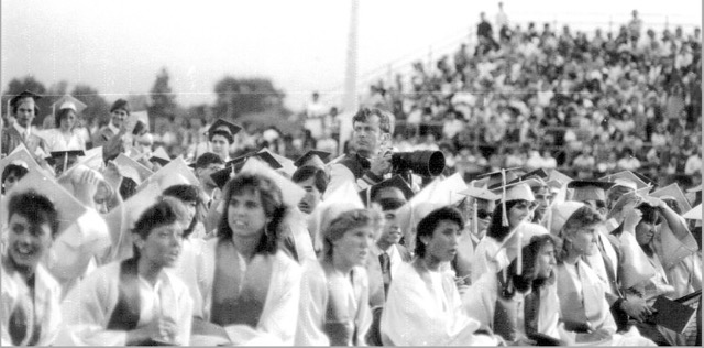 Soifer, right of center, scans the Norco High Class of 1984 graduation ceremonies.