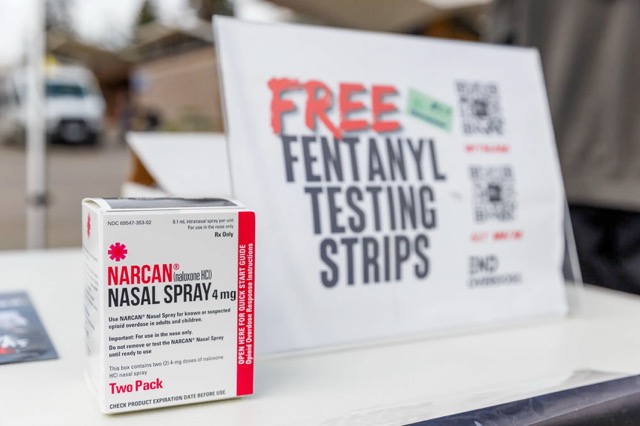 California Gov. Gavin Newsom announced today that the state will sell Naloxone, the overdose-reversal medicine, to any resident at a steep discount. Here, a box of Narcan nasal spray sits at UC Berkeley student organization End Overdose’s table at Sproul Plaza on Jan. 23, 2024.  Credit: Photo by Juliana Yamada for CalMatters
