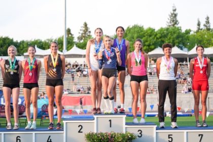 CIF State Meet. AB Hernandez, center, flashes a sign as she shares the first-place spot on the podium with Jillene Wetteland, left, and Lelani Laruelle during a medal ceremony for the high jump at the California high school track-and-field championships in Clovis, Calif., Saturday, May 31, 2025.  Credit: AP Photo/Jae C. Hong
