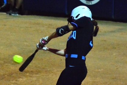Featured Photos 06-06-2025. Norco’s third baseman Sadie Burroughs, hammers a line drive that bounced off the left field wall for a standup double. The drive ignited a three-run Cougar outburst that proved to be the difference as Norco defeated El Modeno of Orange 3 – 0 to win the CIF Division 1 CIF Championship. It’s the Cougars’ seventh crown in 10 trips to the finals starting in 2003.