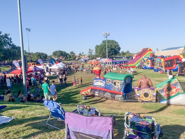The city thought about all ages and ensured kids also had fun and adventure — bounce houses, blow-up waterslides, mazes, and obstacle courses as far as the eyes could see.  Photo by Mia Rotell