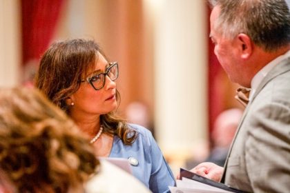 Update Rules for Immigrant Workers. State Sen. Rosilicie Ochoa Bogh, left, speaks with Assemblymember Philip Ting during a floor session at the state Capitol in Sacramento on Aug. 29, 2024. Credit: Photo by Florence Middleton, CalMatters