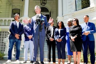 Redistricting. Gov. Gavin Newsom, accompanied by several members of the Texas state Legislature, calls for a new way for California to redraw its voting districts, during a news conference In Sacramento, last month.  Credit:  Photo by Rich Pedroncelli, AP