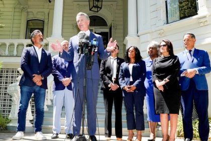 Redistricting. Gov. Gavin Newsom, accompanied by several members of the Texas state Legislature, calls for a new way for California to redraw its voting districts, during a news conference In Sacramento, last month.  Credit:  Photo by Rich Pedroncelli, AP
