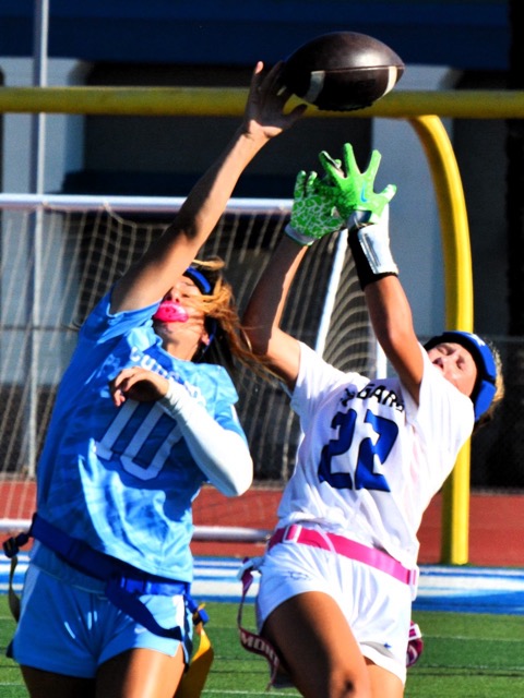 High School Sports Photos 8-22-25 - Flag Football, Volleyball. Norco defender Kennington Moreno (10) knocks the ball away from Beaumont receiver Gemma Jordan (22). In a Cougar fight, Beaumont defeated Norco 28 – 12 in girls flag football action.