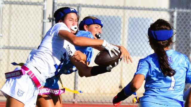 Beaumont’s Capris Capote (32 left) and Norco’s Jadyn Killen (7 center) battle for a pass as Noemi Rodriguez (1 right) watches the play.