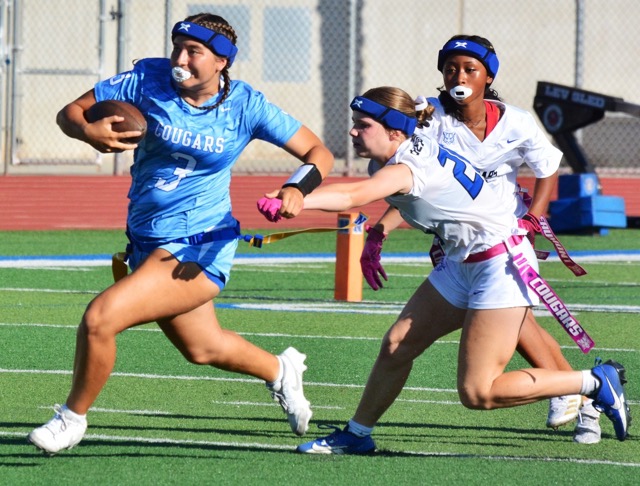 Norco’s Mya Arriola (3) runs for yardage while Beaumont’s Kiera Houston (20 center) and Kaylani Jeter (8 right) pursue.