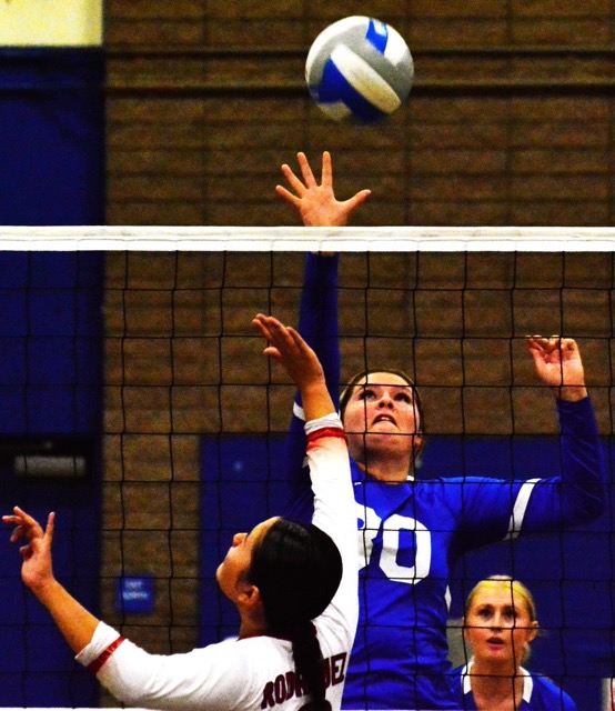 Norco’s Natasja Fairbanks (30) get the ball over Katella’s Leilani Rodriguez during the Cougars 3 – 0 victory over the Knights.