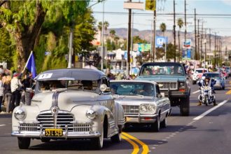 Classic Cars. Classic cars ride along Laurel Canyon Boulevard during a Veterans Day Parade in the Pacoima section of Los Angeles, on Nov. 11, 2022. Credit: AP Photo/Richard Vogel