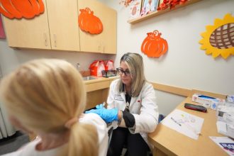 Covid Shot. Pharmacy manager Aylen Amestoy administers a patient with a COVID-19 vaccine at a CVS Pharmacy in Miami, Tuesday, Sept. 9, 2025.  Credit: AP Photo/Rebecca Blackwell