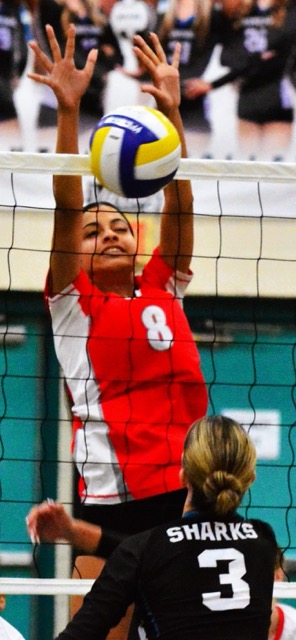 Corona’s Linniah Ballou (8) blocks a shot from Santiago’s Lyla Guillory (3). Photo by Gary Evans