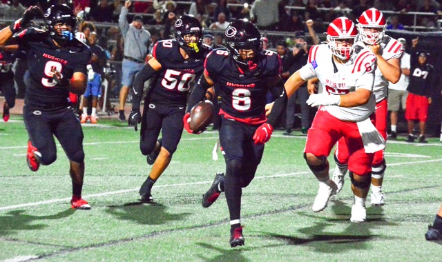 Corona Centennial’s defensive back Jaden Walk-Green intercepted this pass from Mater Dei QB Ryan Hopkins after he was hit by Jonathan McKinley II.  Walk-Green ran 10 yards for the pick 6.  