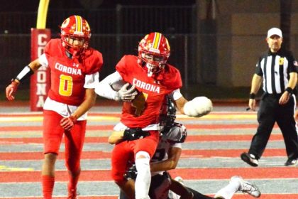 Corona’s Ryker Gazard (4) executes a long run as Royce Hudson (0) trails the play that helped run out the clock in the Panthers’ win.