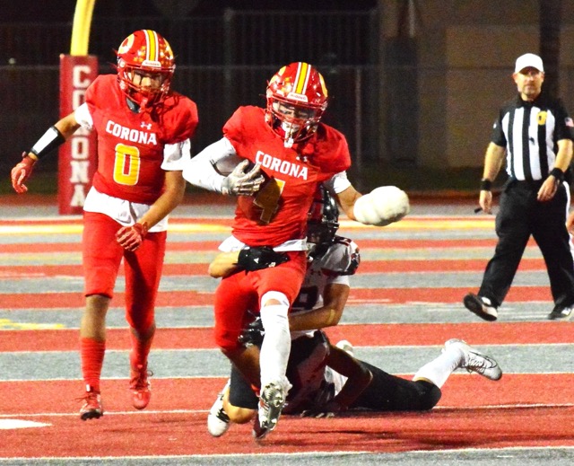 Corona’s Ryker Gazard (4) executes a long run as Royce Hudson (0) trails the play that helped run out the clock in the Panthers’ win.