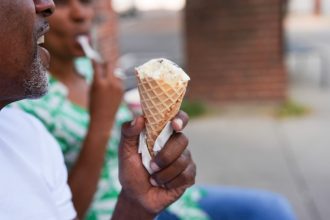 More Sugar. A person eats ice cream Friday, Sept. 5, 2025, in Cincinnati.  Credit: AP Photo/Joshua A. Bickel)