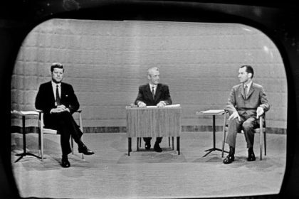 September 26 - Democrat Sen. John Kennedy, left and Republican Richard Nixon, right, as they debated campaign issues at a Chicago television studio on Sept. 26, 1960. Moderator Howard K. Smith is at desk in center. Credit: AP