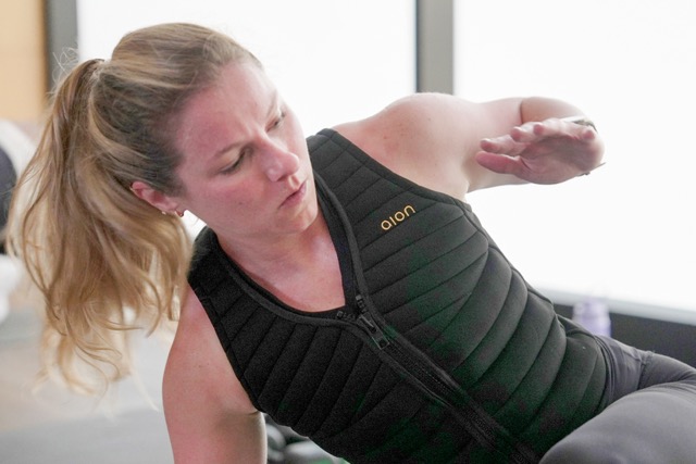 Weighted vests. Nora Capocci wears a weighted vest during an MB360 workout class at the Life Time health club in New York on Wednesday, Aug. 13, 2025.  Credit: AP Photo/Shelby Lum