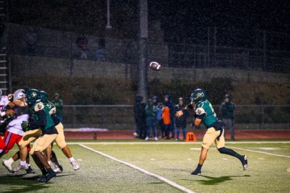 Tahquitz QB Travis Fiallos passes in the rain. The Rancho Verde Mustangs took down the Titans 26-0.