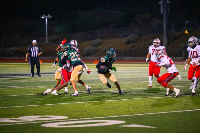 Tahquitz RB Terrell Strong (1) stares down a defender as he finds a hole
