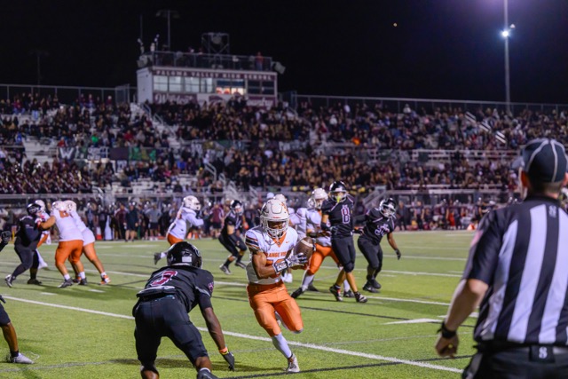 Orange Vista WR Bobby Greer (10) is stopped short of a TD by Paloma Valley’s CB Anthony Fayemiwo (3)