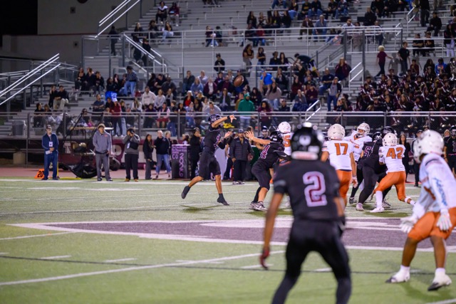 Wildcat QB Isaac Navarro (7) airs out a deep bomb down the field …