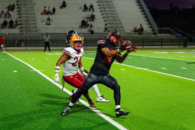 Mt. San Jacinto #8 James Trevino catches a pass right on the sidelines before being run out of bounds