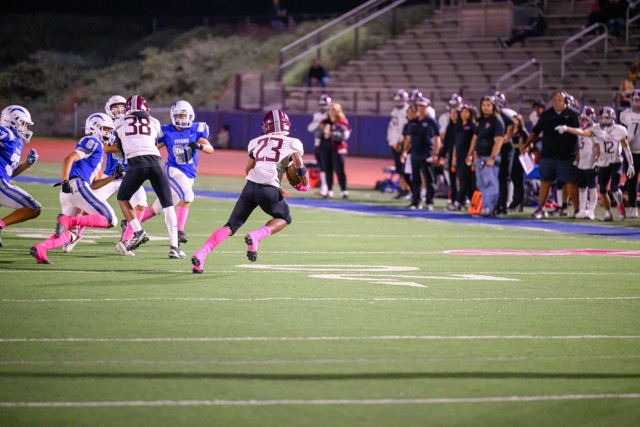 West Valley Mustang #23 Hakeim Hodges runs back a kick return before being tackled 