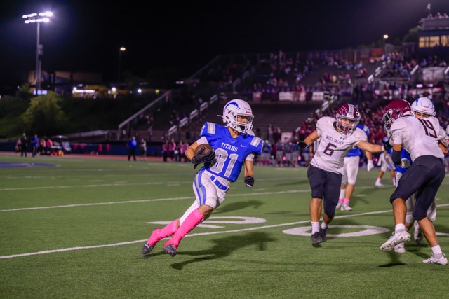 Temescal Canyon’s #81 Aaron Boessler wraps around the corner for a long TD