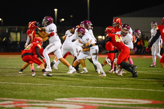 Vista’s Eric Morales bursts through a hole created by his O-line