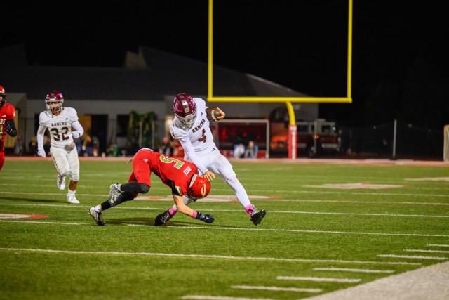 Featured Photos 10-24-2025. The Rancho Buena Vista Longhorns defeated The Fallbrook Warriors 29-21 in the San Diego Section, Valley League game.Longhorn #4 Van Piercy stiff arms Warriors CB #5 Justin Ruiz defender to gain a handful of yards after he was forced out of the pocket