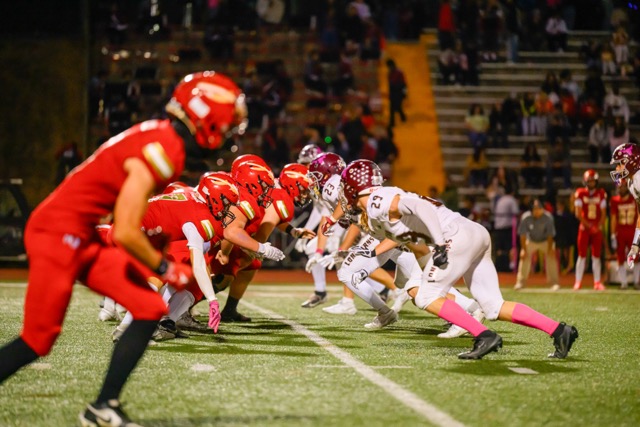 Both teams are moving as the play starts. The O-line and D-line are about to have a violent exchange 